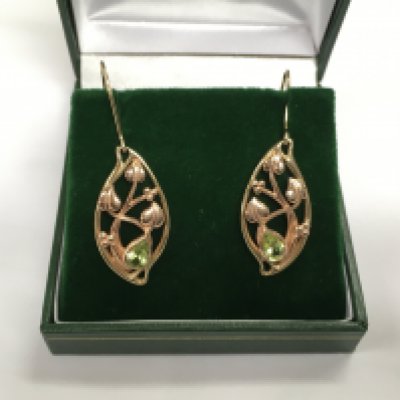 A pair of 10k Welsh bi coloured gold earrings set with peridot, approx 5g. Shipping category A.