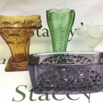 Four coloured glass vases. Shipping category D.