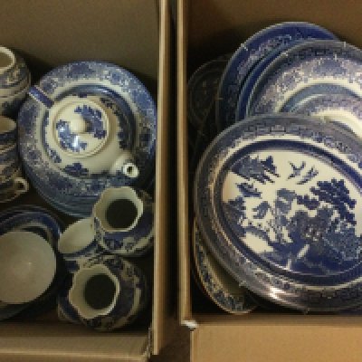 Two boxes of blue and white ceramics in Old Willow pattern. Shipping category D.