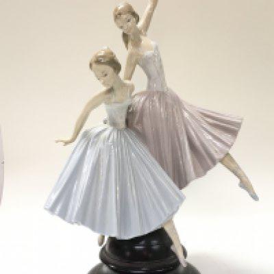 A large Lladro Merry Ballet porcelain figure group. 49cm tall.This lot cannot be posted