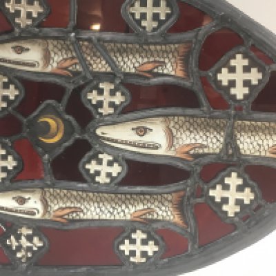 An early leaded stained glass Armorial shield, De Lucy Family interest. 29cm wide 23cm tall. This lot cannot be posted