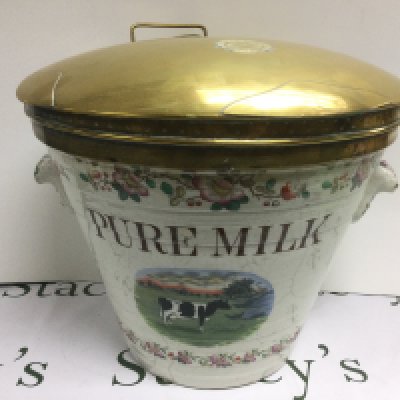 An early 20th Century ceramic milk pail 'Pure Milk' produced for the Dairy Outfit Company, approx height 35cm. Some damage. Shipping category D.