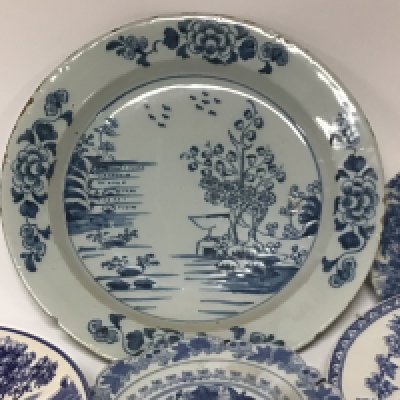 An 18th century delft plate minor chips width to the edge 35cm diameter and a collection of other blue and white plates.