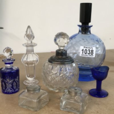 A small collection of glass bottles including Art Deco