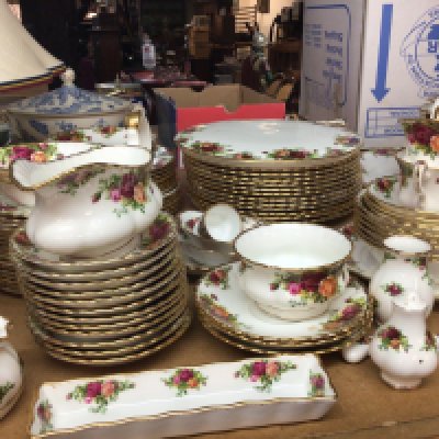 An Extensive Royal Albert Old English country rose dinner and tea set with tureens cups saucers graduating sizes of plates sauce boat cake stand and more all good condition except cracked tea pot lid most first quality.
