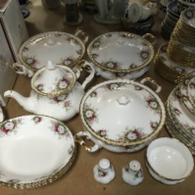 A large collection of Royal Albert tea and dinner ware, comprising tureens, two cake stands, coffee and tea pot etc