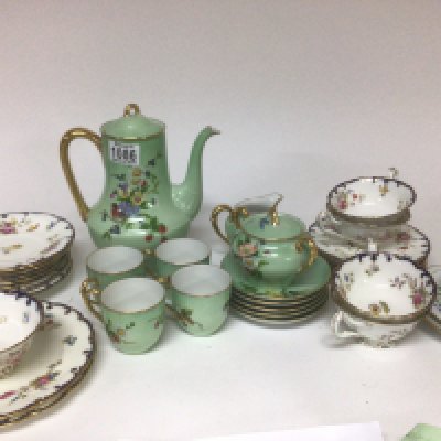 A Meissen porcelain hand painted cup saucer and plate a Cauldon porcelain part tea set and a Bavarian four place tea set decorated with flowers on a light green ground.