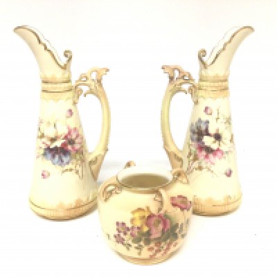A pair of Royal Worcester hand painted vases with raised handles and a small posy pot all without any obvious damage or restoration. Hight 21cm (3)
