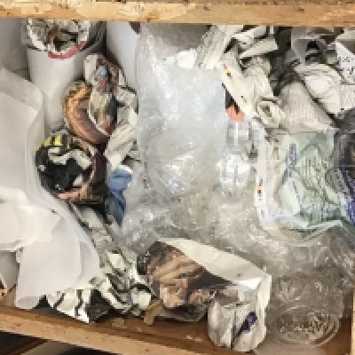 A tea chest containing a large collection of mixed cut glass.