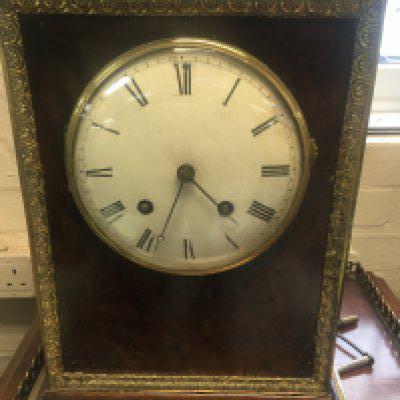 WITHDRAWN - A 19h century French silk suspension table clock the bur and ormaloo cases inset with dial with Roman numerals the movement striking on a bell 43 cm .