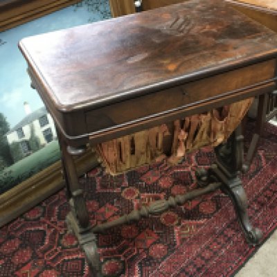 A pen Early Victorian Rosewood work box with a sliding drawer and wool box on harp shaped supports and cabriol legs.