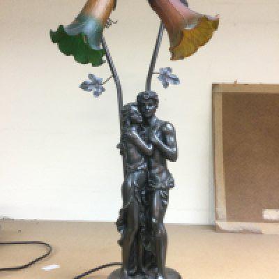 A figural table lamp with coloured glass shades, approx height 68cm. Shipping category D.