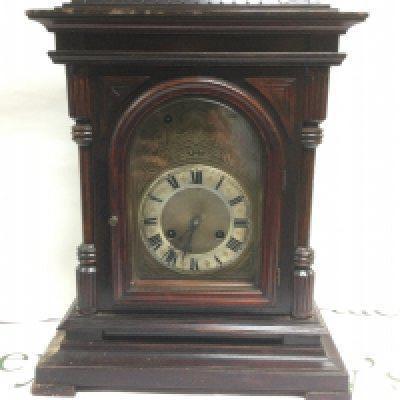 Two eight day mahogany cased mantle clocks with silvered dials. Shipping category D.