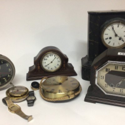 A black slate mantel clock fitted with a French movement an Edwardian clock a vintage alarm clock and others including watches.