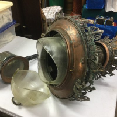 An early 20th Century French copper and brass street lamp fitting glass a/f, together with a converted coaching lamp (2). Shipping category D.