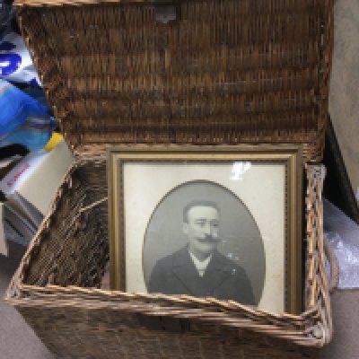 A large vintage wicker basket, approx height 52cm, together with a framed Victorian photograph of a young gent (2). Shipping category D.