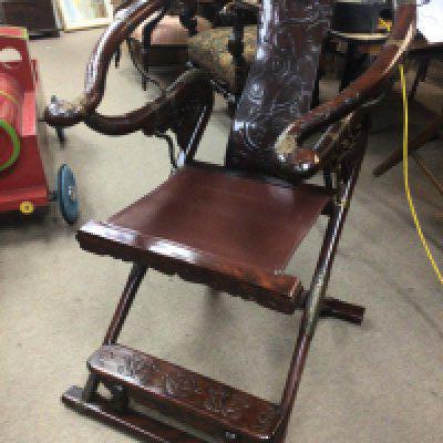 A quality Chinese folding hardwood and metal mounted chair with a leather seat. Height 97cm