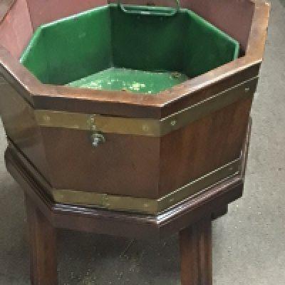 A brass bound mahogany wine cooler of flower jardiniere on fluted legs. Hight 50cm