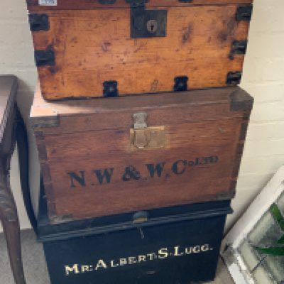 3 vintage travel trunks.