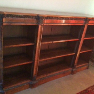 A quality Victorian French influence walnut open bookcase with gilt metal mounts a cross banded edge and three sections of adjustable shelves length 2m x 116 cm heigh approximately. Ice condition in keeping with age.
