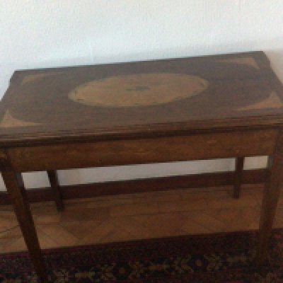 An Early 19th century inlaid card table.