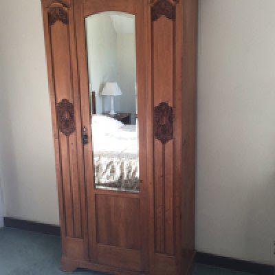 A late Victorian satinwood wardrobe with a single mirrored door.