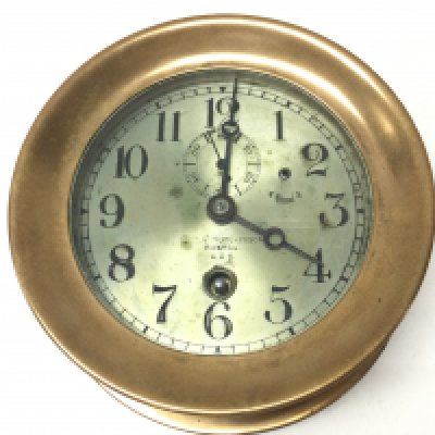 An early 20th century American brass Chelsea ships clock. Chas. C. Hutchinson, Boston U.S.A. This lot cannot be posted