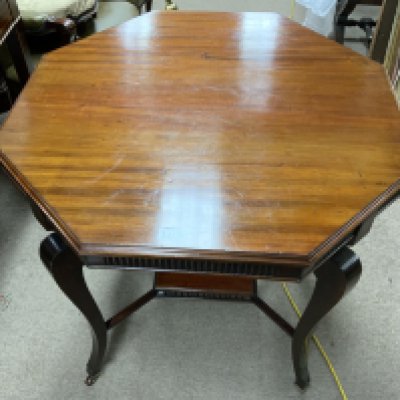 A mahogany occasional table with sabre legs. 76cm x 76cm
