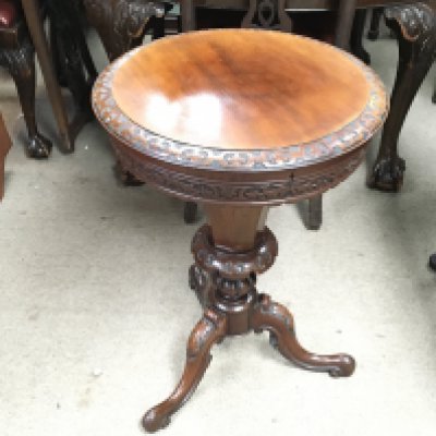 A circular mahogany sewing box. 70cm tall and 53cm diameter