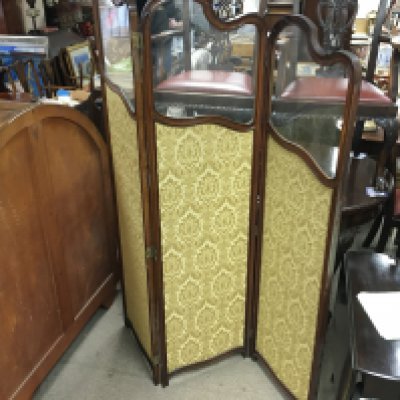 A three section mahogany screen.