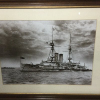 A framed picture of HMS Exmouth