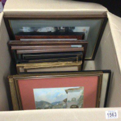 A box containing small decorative prints and pictures.