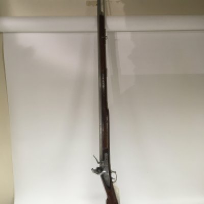 A Flint lock Brown Bess Musket circa 1801-08 believed to be the New land pattern steel barrel and mechanism the action with crown mark and stamped Wright with other interesting marks of the East India Company.Brass fittings a nice example.