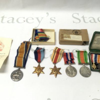 A collection of first and Second World War medals including a set of miniature medals on bar. First World War medal was awarded to PTE J.W.SMITH LEIC.R. Postage B