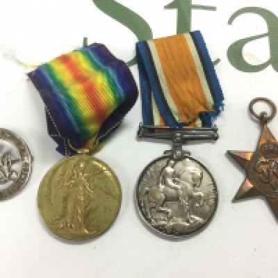 A small mixed GB medal group and a cap badge. Shipping category A.