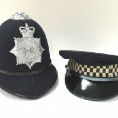 Two police hats including a Metropolitan hat . Postage category C