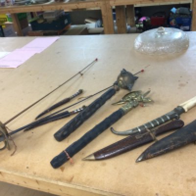 A collection of weaponry including a Mace, Fencing sabres, axe, Kurki, bone handled dagger. This lot cannot be posted