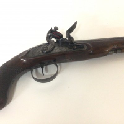 A Quality late 18th century flintlock pistol maker John Bass of Grantham Lincolnshire. The Pistol with carved walnut full length stock elaborate trigger guard action engraved with makers name Bass in very good condition action functional. John Bass was a nephew of world renowned London Gun Smith John Twigg there was a family partnership Twigg & Bass 1788-90 length 30cm