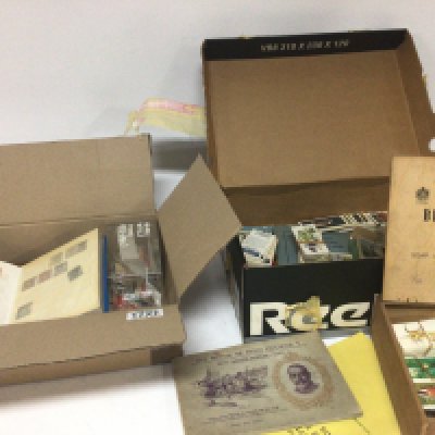 A box containing mixed stamps including a small album of British stamps a collection of Cigarette cards and tea cards. (2)