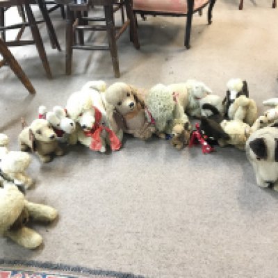 A large collection of various vintage dog toys , mostly with zipper storage compartments