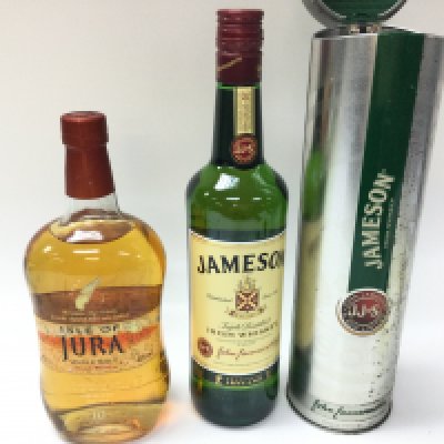 A bottle of Jura single malt whisky and a bottle of Jameson whiskey. Both 700ml bottles and sealed.