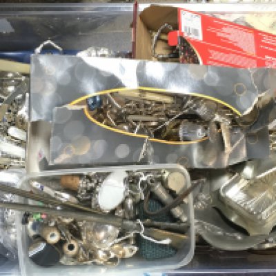 A collection of silver plated items including cutlery, napkin holders, dishes etc