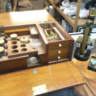 An Austrian microscope by C. Reichert Wien with a wooden case of lenses and other accessories. This lot cannot be posted