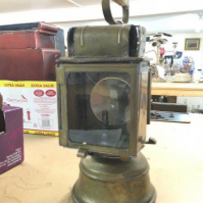 An Unsual all brass carrying lamp with handle by dehail and greener plm French , this lot cannot be posted