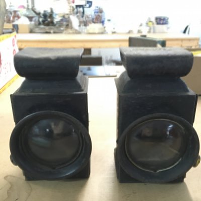 Early black painted car lamps with burners , one impress Ford . This lot cannot be posted