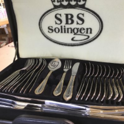A canteen of Solingen cutlery in a fitted case , postage category C