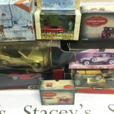 A box of die cast vehicles both boxed and loose including Burago and Corgi examples. Shipping category D.