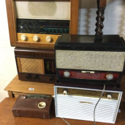 A collection of assorted vintage radios.