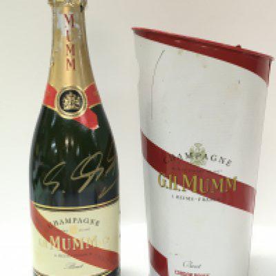 A bottle of G.H Mumm champagne signed by Michael Schumacher, former German Formula One racer. This lot cannot be posted