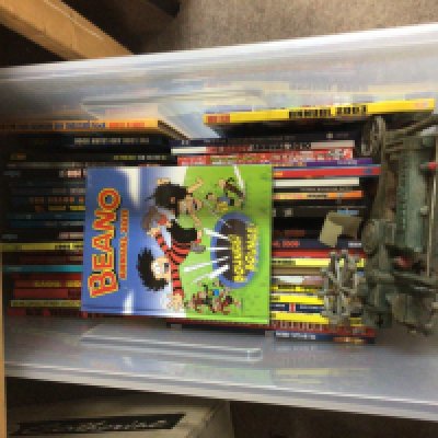 A box containing mixed annuals Dandy Beano 2000AD and a replica cast metal vintage tractor and other oddments.